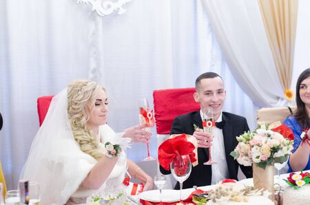 Bride and Groom at wedding Day walking Outdoors on spring nature. Bridal couple, Happy Newlywed woman and man embracing in green park. Loving wedding couple outdoor. 12.03.18 lutsk, Ukraine.のeditorial素材