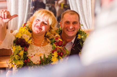 Bride and Groom at wedding Day walking Outdoors on spring nature. Bridal couple, Happy Newlywed woman and man embracing in green park. Loving wedding couple outdoor. 12.03.18 lutsk, Ukraine.のeditorial素材