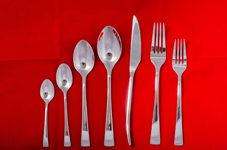 spoon isolated on red background.