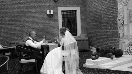 Bride and groom walking away in summer park outdoors.のeditorial素材