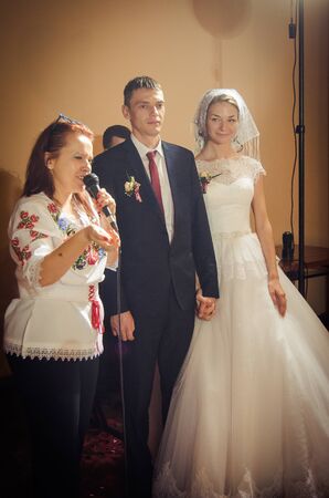 Ukraine, Lutsk - 27.10.2013: the Wedding ceremony. Lovers of nature walks in Park. Beautiful delicate and romantic couples, loving each other. Editorial reportage typical wedding.のeditorial素材