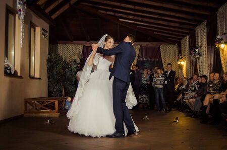 Ukraine, Lutsk - 27.10.2013: the Wedding ceremony. Lovers of nature walks in Park. Beautiful delicate and romantic couples, loving each other. Editorial reportage typical wedding.のeditorial素材