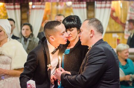 Bride and Groom at wedding Day walking Outdoors on spring nature. Bridal couple, Happy Newlywed woman and man embracing in green park. Loving wedding couple outdoor. 12.03.18 lutsk, Ukraine.のeditorial素材