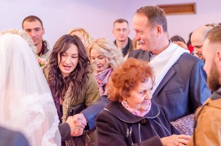 Bride and Groom at wedding Day walking Outdoors on spring nature. Bridal couple, Happy Newlywed woman and man embracing in green park. Loving wedding couple outdoor. 12.03.18 lutsk, Ukraine.のeditorial素材