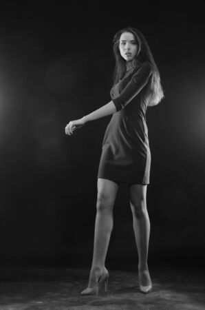 Fashion photo of young lady in elegant black dressの写真素材