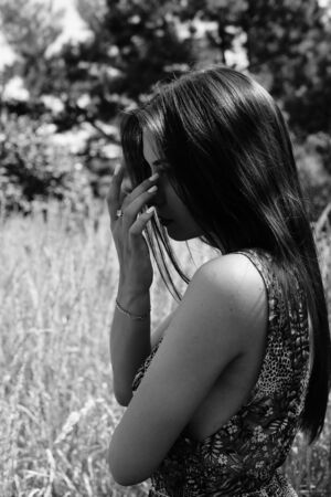 Portrait of an young beautiful sexy woman on the nature.の写真素材