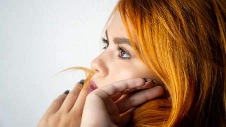 Portrait of beautiful red-haired girl face closeupの写真素材