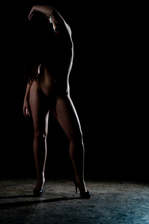 Sexy woman naked body. Nude sensual woman erotic buttocks back isolated on blackの写真素材
