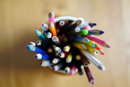 Colored pencils in a terracotta glassの写真素材