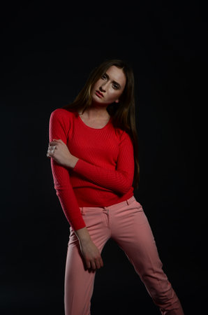 beautiful young caucasian woman portrait on black backgroundの写真素材