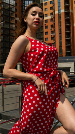 girl in a red dress in white polka dotsの写真素材