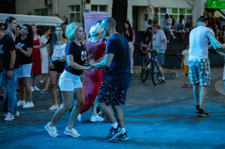 Lutsk, Ukraine - August 4, 2018. People dancing salsa and bachata in outdoor cafe by Diana in Lutsk.のeditorial素材