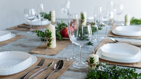 Elegant table setting with cutlery and wineglassesの写真素材