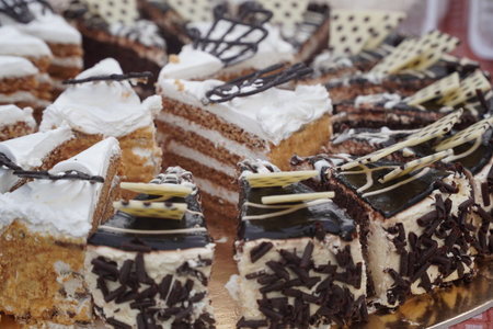 Cake with cream and chocolate on the table. Selective focus.
