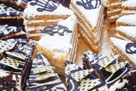 Variety of cakes on display at a food market in Paris, France.の写真素材