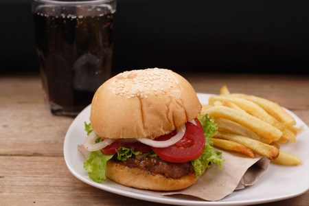 hamburger and french fries on wooden backgroundの写真素材