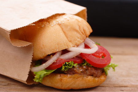 hamburger and french fries on wooden backgroundの写真素材