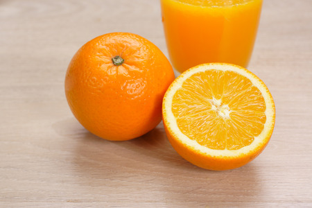 Orange juice with Oranges on wooden backgroundの写真素材