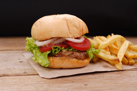 hamburger and french fries on wooden backgroundの写真素材