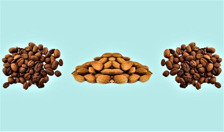 illustration of a set of coffee seeds and almonds on a blue backgroundの写真素材