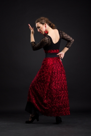 Flamenco dancer in black and red dress with red earringsの写真素材