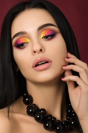 Beauty portrait of woman with colourful eye makeupの写真素材