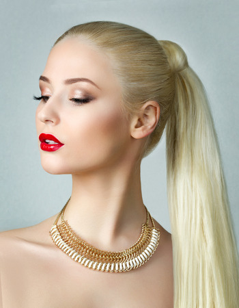 Beauty portrait of gorgeous blonde woman with ponytailの写真素材