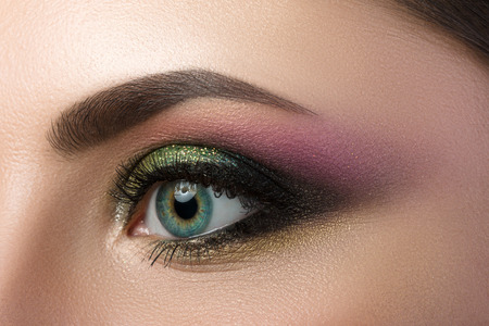 Close-up view of blue female eye with beautiful modern creative make-upの写真素材