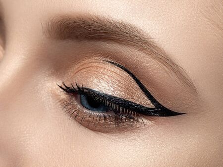 Closeup of beautiful woman eye with fashion makeupの写真素材