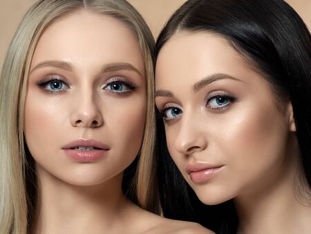 Portrait of two young beautiful caucasian womenの写真素材