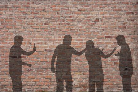 Bullying scene shadow on the wallの写真素材