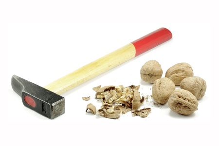 Walnut crushed by a hammerの写真素材