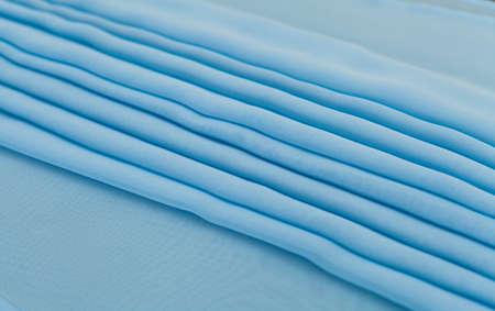 Color blue textil, silk fabric with pleatsの写真素材