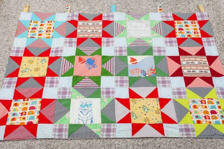 Patchwork, sewing with pieces of fabric, multi-colored segments.