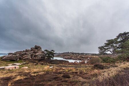 Perros Guirec, Ploumanac'h Lighthouse, Mean Ruz Lighthouse, la Manche,at winter, rocks and wavesの写真素材