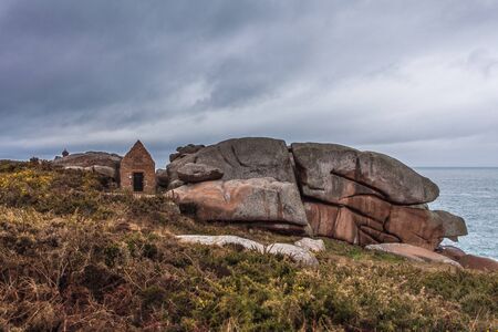 Perros Guirec, Ploumanac'h Lighthouse, Mean Ruz Lighthouse, la Manche,at winter, rocks and wavesの写真素材