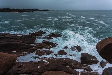 Perros Guirec, Ploumanac'h Lighthouse, Mean Ruz Lighthouse, la Manche,at winter, rocks and waves