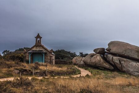 Perros Guirec, Ploumanac'h Lighthouse, Mean Ruz Lighthouse, la Manche,at winter, rocks and wavesの写真素材