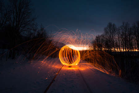 Fire painting at winter at nightの写真素材