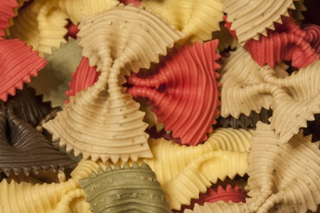 background of multicolored macaroni figured as bowの写真素材