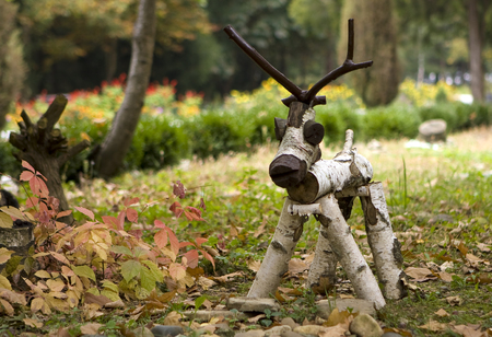 folk arts - a figure of a wooden deer in the meadowの写真素材