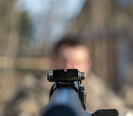 a person in the sight of a machine gunの写真素材