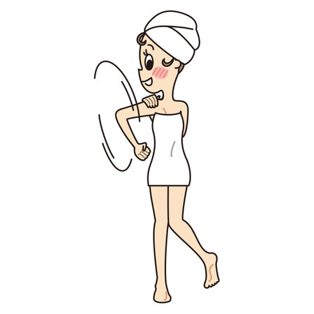 Young woman wrapped in bath towel with shoulders turnedの写真素材