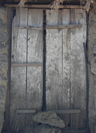 Old wooden door at jeju korea close permanently,local art & culture of koreaの写真素材