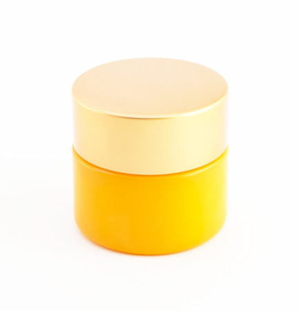 cosmetic bottle on white background,orange color,isolatedの写真素材