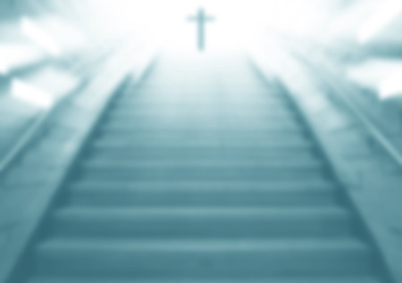 Staircase going up to the Christian religious cross with cool light,blurry scene same dreamの写真素材