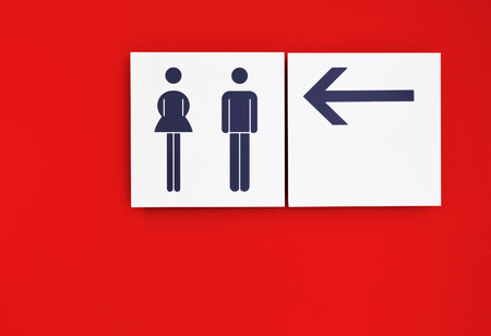 toilet sign with red backgroundの写真素材