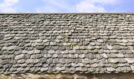 wooden roof tiles with sky backgroundの写真素材