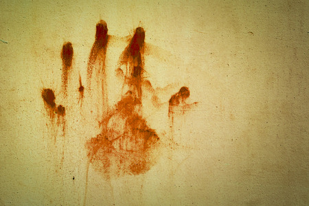 hand bloodstains on the old wallの写真素材