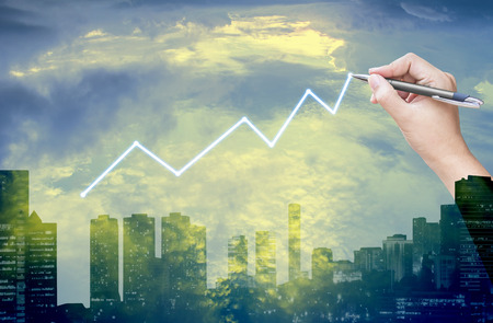 hand drawing graph with sky and city background,double exposure processの写真素材